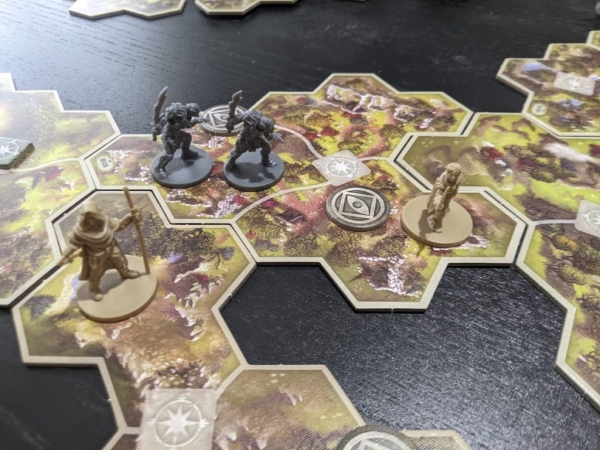 Two orc spies have found Bilbo in the Journeys in Middle Earth board game.