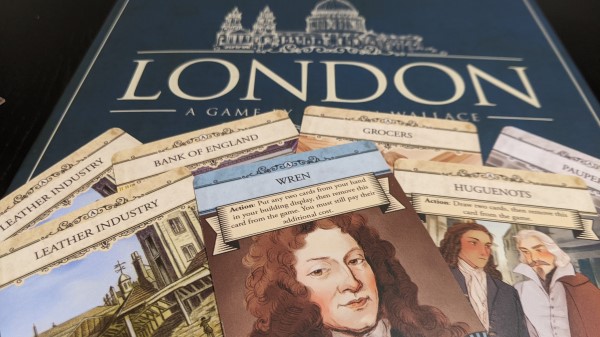 Showing some of the card art from London in front of  the box.